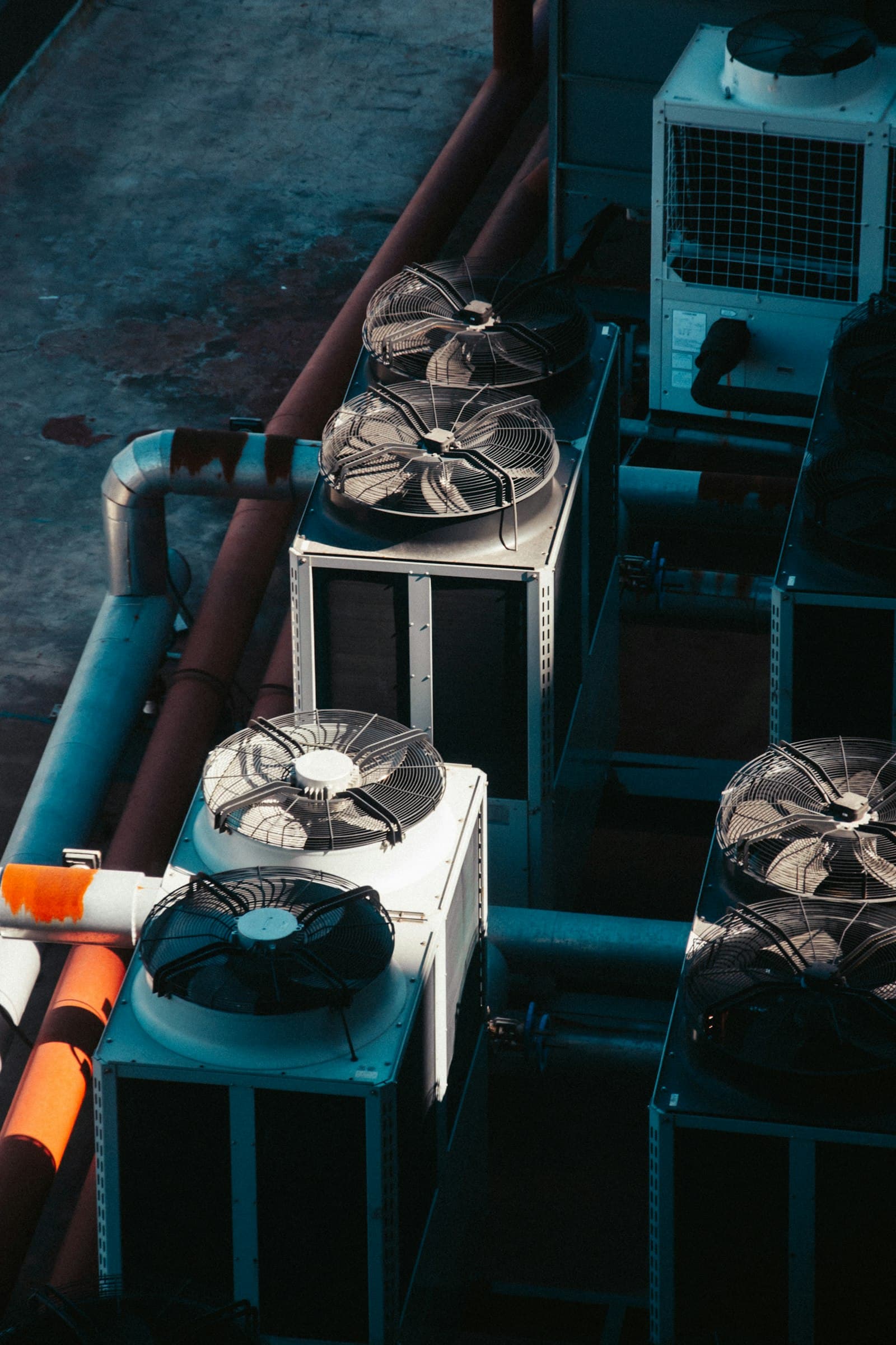 Rows of industrial cooling units on a rooftop