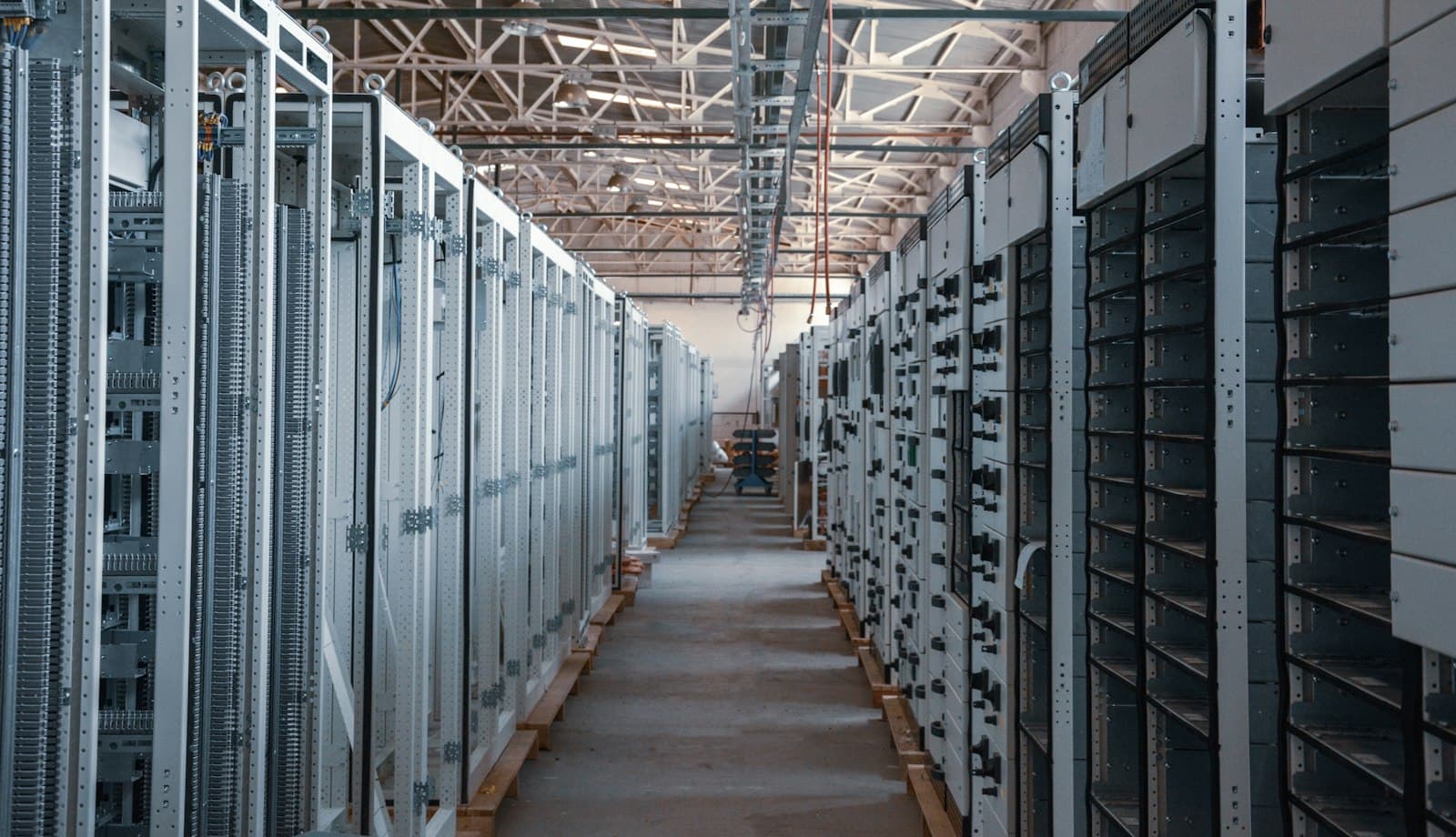 Aisle between rows of equipment racks in a data hall